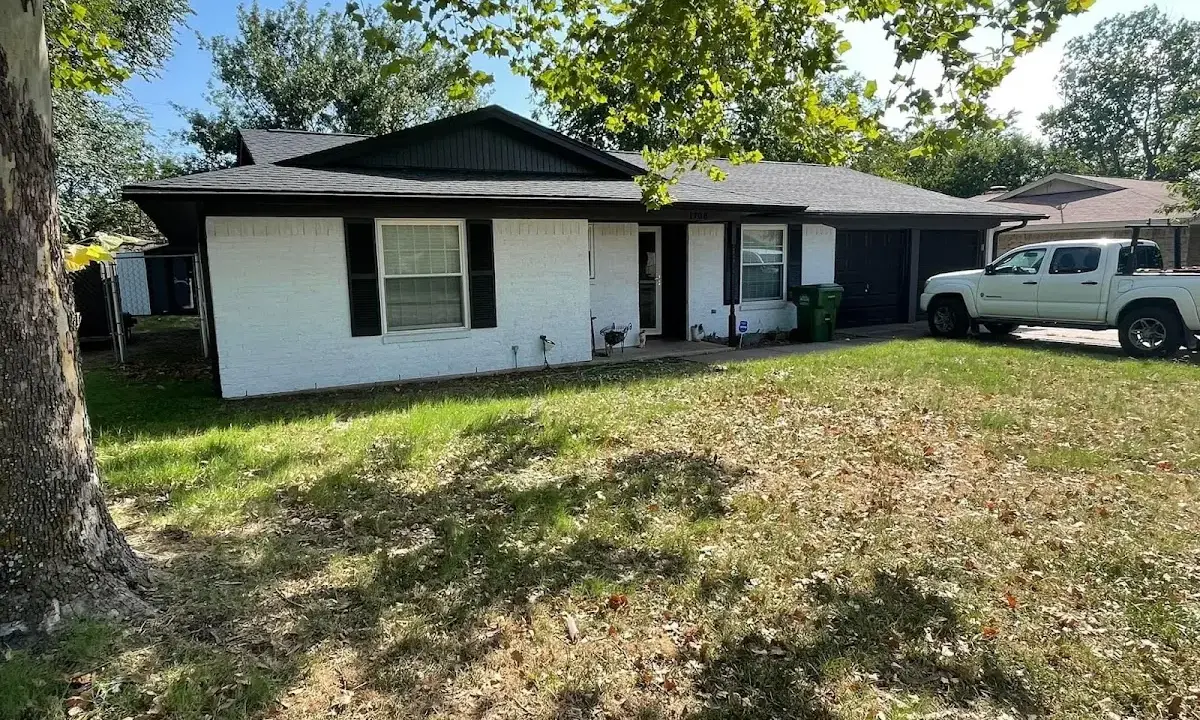 Professional roofing crew working on a residential roof in Waterbury